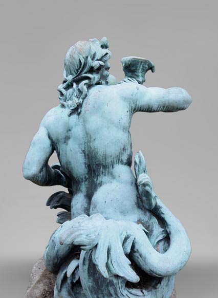 Important Louis XIV style pair of Tritons sounding a conch shell in bronze with green patina_fr