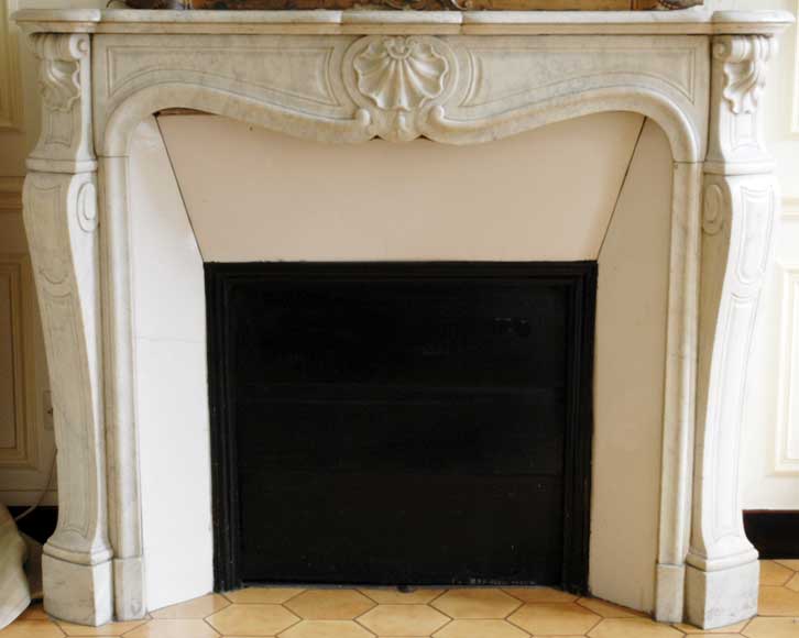 White_marble_Louis_XV_mantel_with_three_shells.jpg