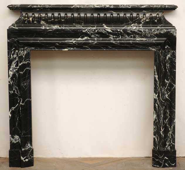 Black_marble_Bolection_mantel_with_acroterion.jpg