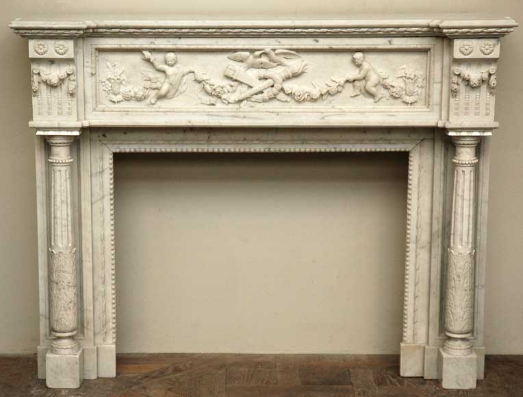 Antique_Louis_XVI_mantel_in_Carrara_Marble_with_Columns_and_Cherubs.jpg