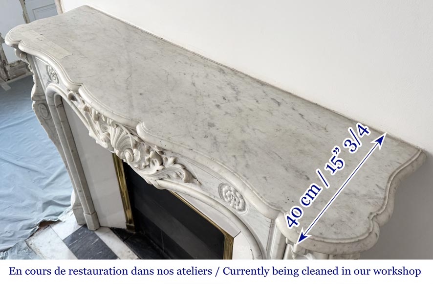 Cheminée de style Louis XV ornée d'une large coquille Cheminée de style Louis XV ornée d'une large coquille-12