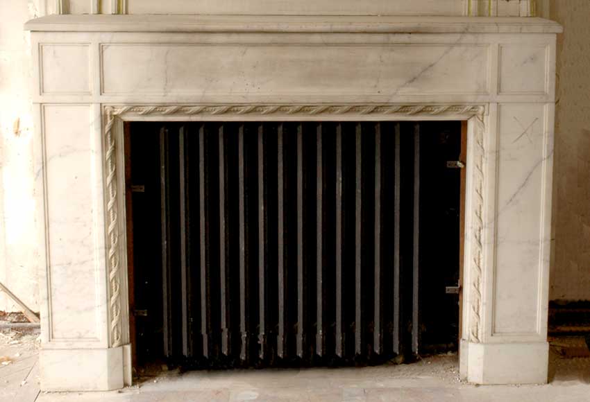 Louis_XVI_Style_white_marble_mantel_with_spiral_ribbon_decor.jpg