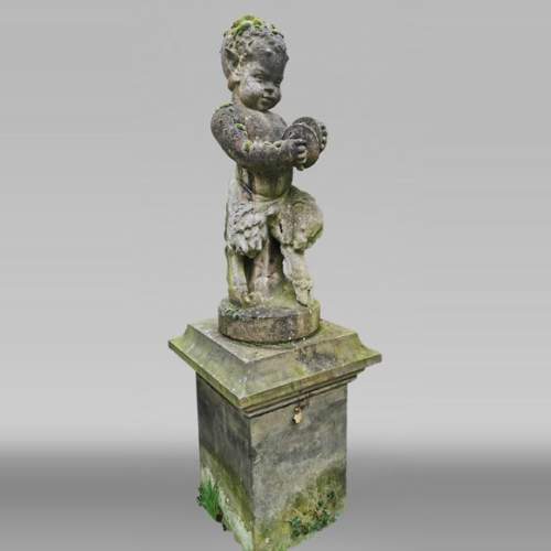 Statue d'un jeune faune musicien en pierre composite, début du XXe siècle