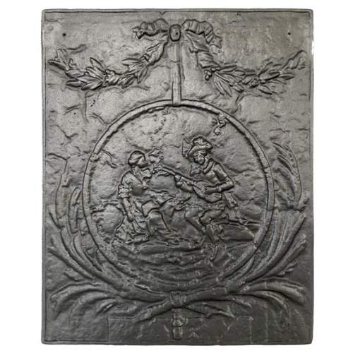 Plaque de cheminée ornée d'une scène galante dans un médaillon