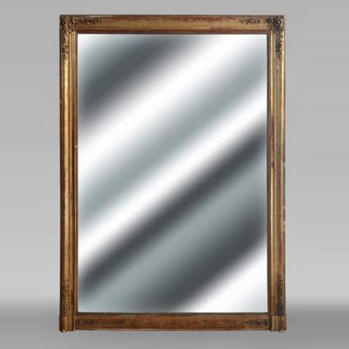 Trumeau doré d'époque Louis Philippe décoré de fleurs.