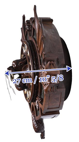 Pendule XIXe en noyer sculpté à décor de chimères, plaques d’agate mousseuse, bronze argenté, émail. Pendule XIXe en noyer sculpté à décor de chimères, plaques d’agate mousseuse, bronze argenté, émail.-11