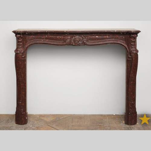 Cheminée ancienne de style Louis XV en marbre Rouge Griotte