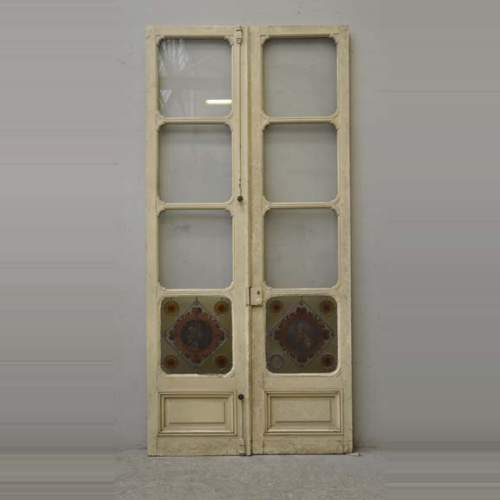 Double porte à décor de vitrail à profil d'homme et de femme en médaillon