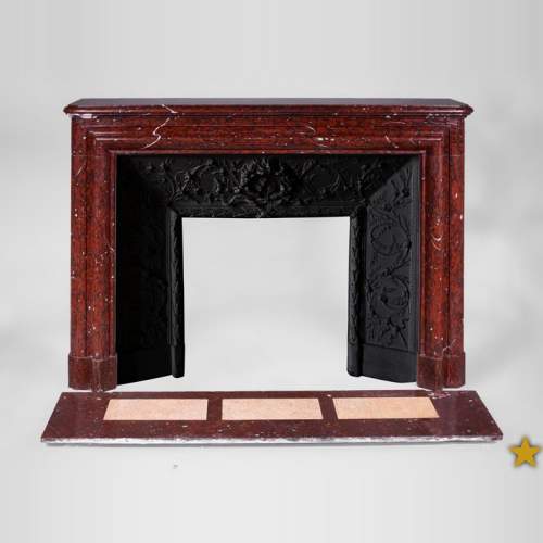 Cheminée ancienne de style Louis XIV en marbre Rouge Griotte avec son intérieur en fonte