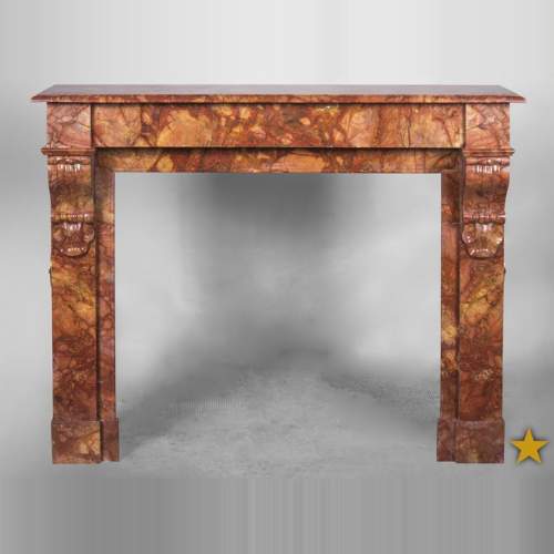 Cheminée ancienne de style Napoléon III, en marbre Brèche Sanguine, à modillons