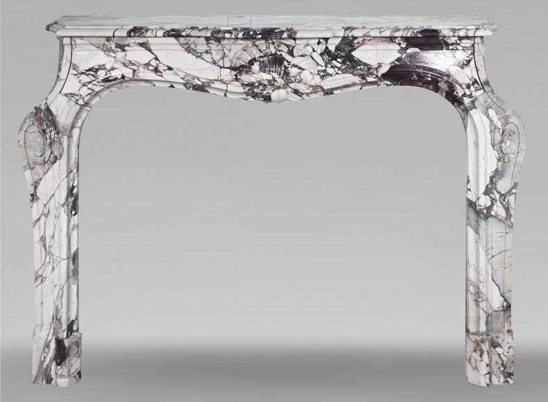 Cheminée de style Louis XV en brèche violette, décorée d'une coquille Cheminée de style Louis XV en brèche violette, décorée d'une coquille-0