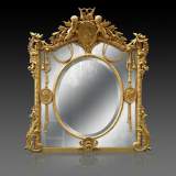 Superbe miroir à parecloses Napoléon III en bois et stuc doré à décor de putti et de profils de femmes en médaillons