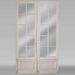 Double porte en bois à carreaux vitrés