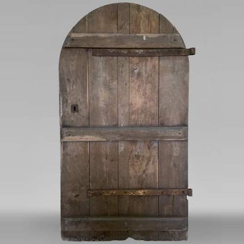 Porte en chêne au dessus arrondie du XVIIIe siècle