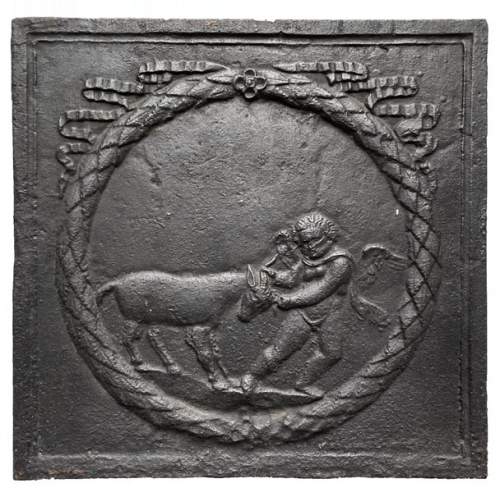 Plaque de cheminée du XVIIIe siècle figurant un amour s’amusant avec une chèvre