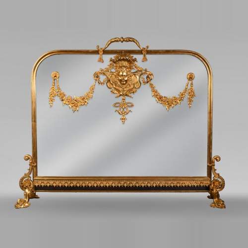 Pare étincelle de style Napoléon III au masque de femme et guirlande de fleurs en bronze doré et verre