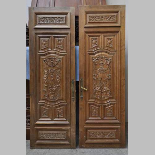 Fausse paire de portes anciennes en chêne sculpté du XIXè siècle