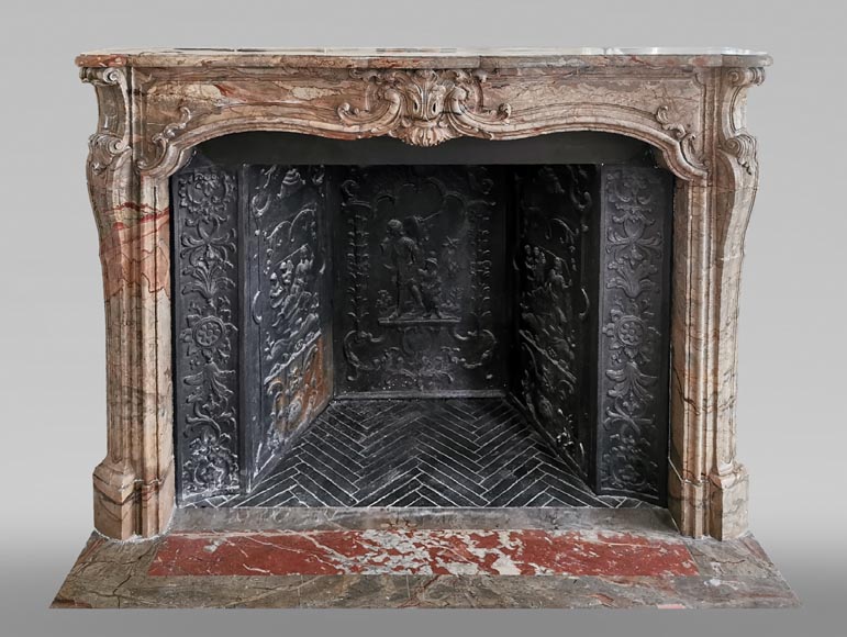 Cheminée ancienne de style Louis XV richement ornée en marbre Sarrancolin-0