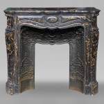 Cheminée de style Louis XV à marbre Portor