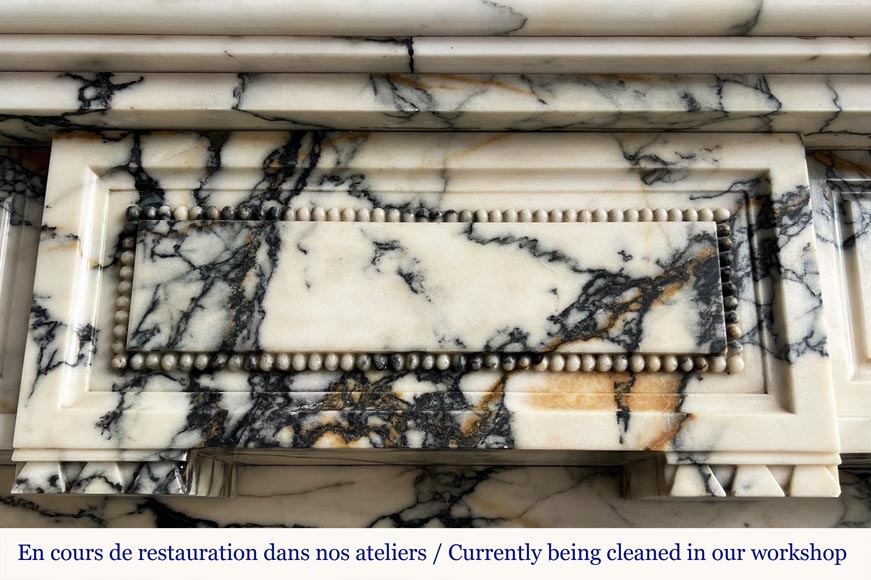 Cheminée de style Louis XVI en marbre Paonazzo, à décor de frise de perle-1