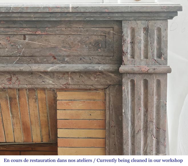 Cheminée de style Louis XVI aux pieds cannelés en marbre enjugerais-6